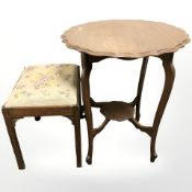 An Edwardian shaped topped occasional table and a mahogany and needlework stool