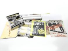 A collection of reproduction unframed posters, including The Clash, Sex Pistols,