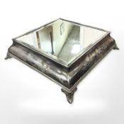A Victorian silver-plated cake stand with mirrored top, width 51cm.