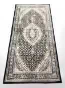 A rug of Tabriz design,