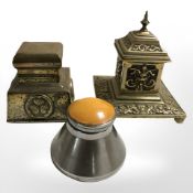Two brass Art Nouveau inkwells and a later stainless steel conical example.