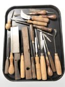 A group of wood working chisels, saw,