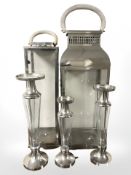 Two chrome plated candle lanters and three similar vases, tallest 90 cm.