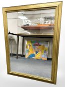 A bevelled contemporary overmantel mirror, 92 cm x 117 cm.