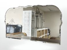 An Art Deco frameless etched mirror depicting a bird perched on branch, width 69 cm.