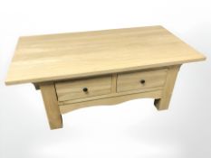 A contemporary oak two drawer storage coffee table, width 115 cm.