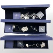 Two Swarovski necklaces and a bracelet, all boxed.