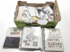 A large quantity of world stamps, loose and in albums.