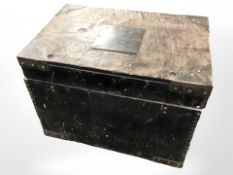 A 19th century ebonised and metal bound storage chest, width 50 cm.
