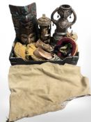 A group of tribal carvings, Native American style bead work moccasins,