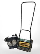 A Ferm KZ-205 circular saw and a push along garden mower