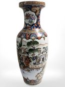 A reproduction oriental porcelain baluster vase depicting traditional scenes, height 59 cm.