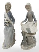 A Lladro figure of a lady with a rabbit and her feet, and a further lady holding daffodils,