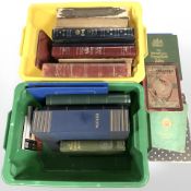 A collection of empty stamp albums, some leather bound,