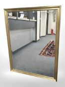 A contemporary bevelled gilt framed overmantel mirror, 101 cm x 131 cm.