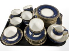 Thirty four pieces of Wedgwood cobalt blue and gilt tea china, pattern X9046.