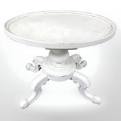 A white painted oval occasional table, width 75 cm.