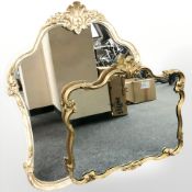 A reproduction cream and gilt mirror, 97 cm x 74 cm, plus a further similar gilt mirror.