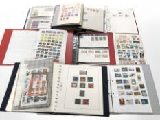 Eight albums of world stamps and a further plastic folder containing stamp sheets, etc.