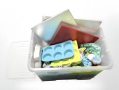 Quantity of metal and plastic kitchen moulds, measuring cups, cake stands,