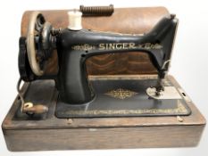 An antique Singer hand sewing machine.