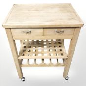 A pine butcher's block on shepherd's castors,