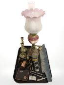 A ceramic and glass oil lamp, pair of brass barley twist candlesticks, Ronson lighter, nutcrackers,