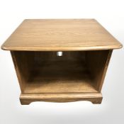 An Ercol elm entertainment/lamp table,