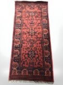 A Balouch rug, Afghanistan, 180 cm x 81 cm.