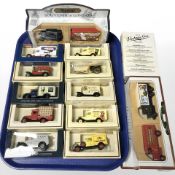 A group of boxed die cast buses and delivery vans, including Days Gone, Hamleys, etc.