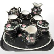 A group of Maling dressing table china and tea china on black ground.