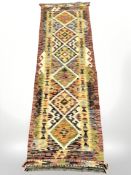 A Chobi Kilim runner, 200 cm x 61 cm.