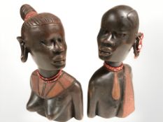 Two African carved hardwood busts of ladies, height 26 cm.