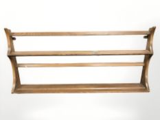 An Ercol stained elm plate rack,