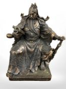 An oriental bronzed figure of a seated emperor, height 41 cm.