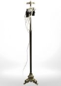 An ornate gilt brass tripod standard lamp (Continental plug)