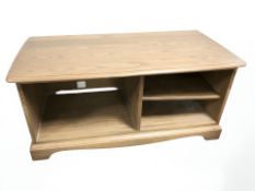 An Ercol elm entertainment unit, 111 cm x 52 cm x 50 cm.