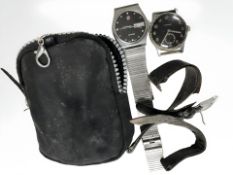 A Titus military style stainless steel wristwatch and a further Rado stainless steel wristwatch.