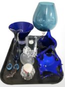 An oversized blue glass goblet, several vases, basket, dolphin ornament, quartz timepiece, etc.