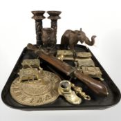 A group of brass trinket boxes, sun dial, Eastern carved candle sticks,