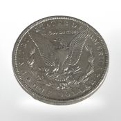 A United States silver one dollar coin, 1900.