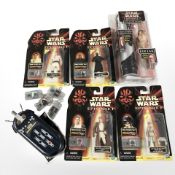 A group of Hasbro Star Wars Episode I figurines.