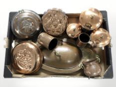 A group of copper plated jelly moulds, mugs, miniature cauldron and other kitchenalia.