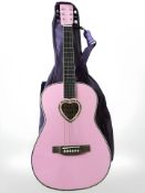 A girl's acoustic guitar.