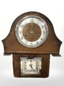 Two Art Deco mantel clocks, one oak and one walnut.