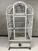 A large painted metal bird cage,