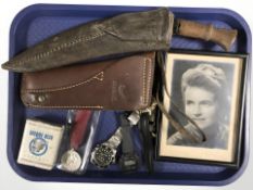 A kukri knife in sheath, leather pistol holster, reproduction Waterloo medal, quartz wristwatches,