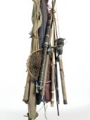 A group of split cane fishing rods, landing net, etc.