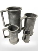 Four graduated 19th century pewter tankards, tallest 18 cm.