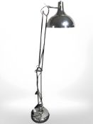 A contemporary chrome effect angle poised standard lamp.